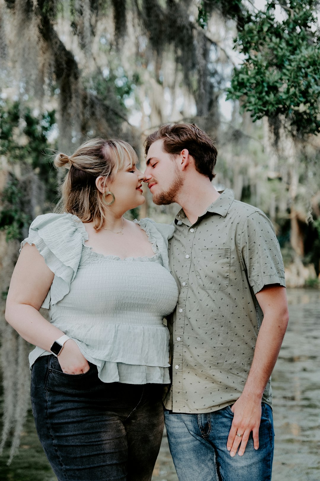 man and woman kissing during daytime