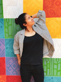 woman in black tank top and gray cardigan