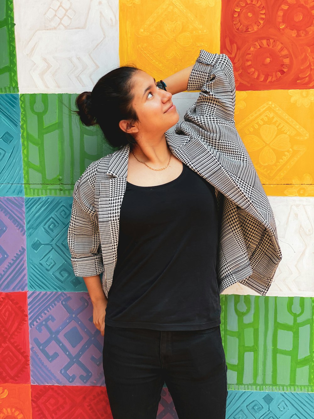 woman in black tank top and gray cardigan