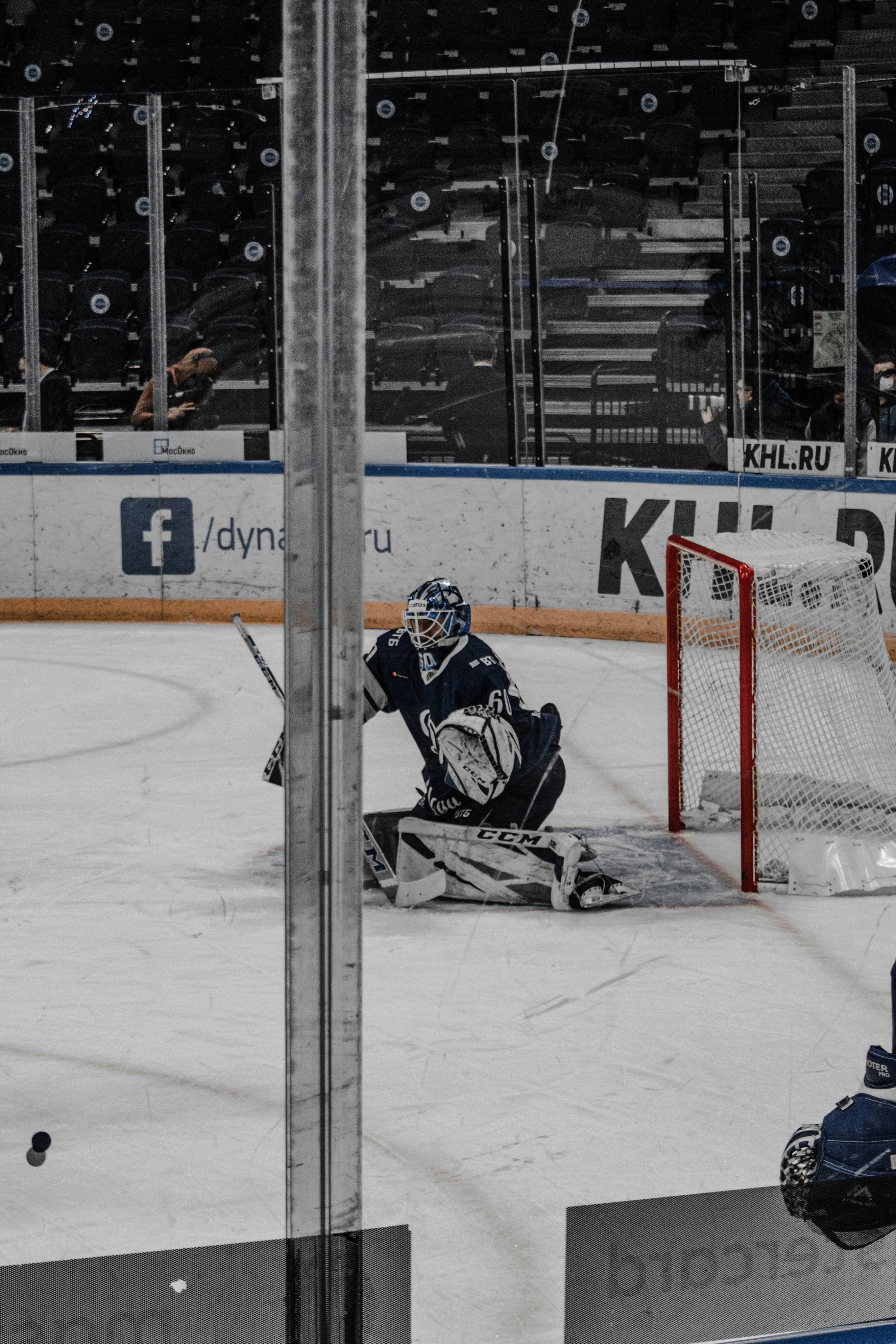 man in black ice hockey jersey playing ice hockey