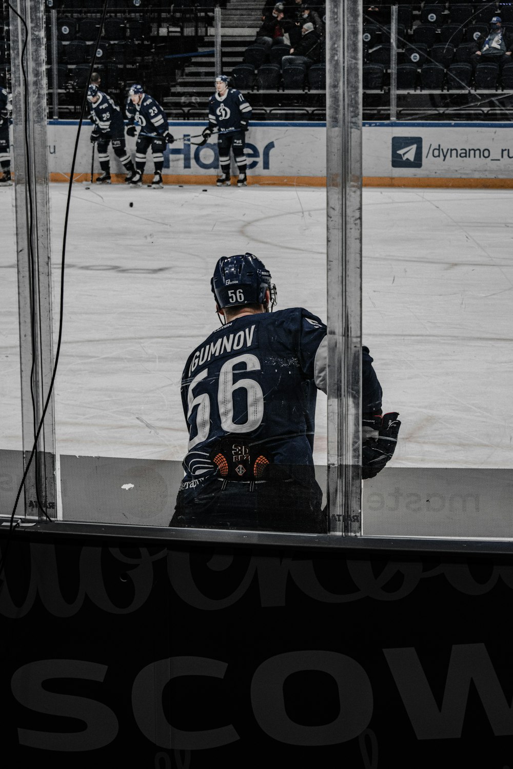 man in blue and white ice hockey jersey