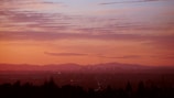 A scenic view of a city skyline during sunset.