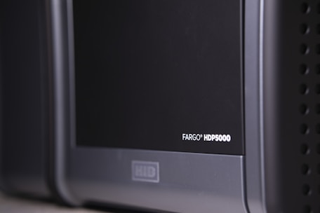 Close-up of a thermal barcode label printer producing crisp labels.