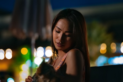 A serene scene of a bierbori companion sitting beside a smiling user in a cozy, softly lit living room.