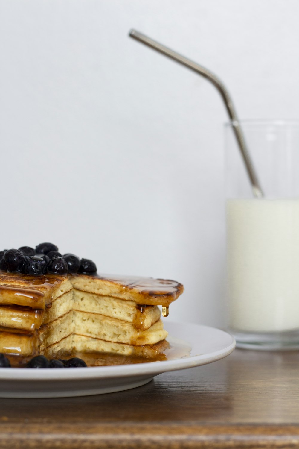 waffle with white cream on white ceramic plate