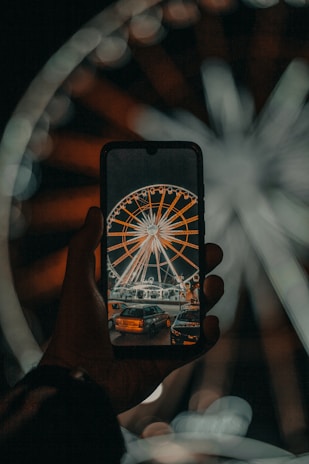 Close-up of a smartphone showing a customer spinning a digital reward wheel on stayo.