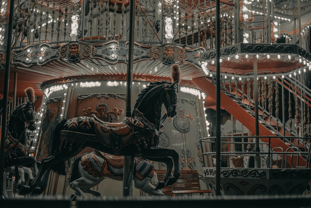 people riding on horse carousel