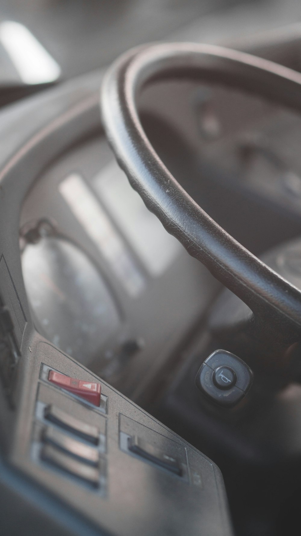 black and gray car steering wheel