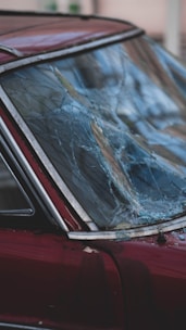 broken glass on red wooden table