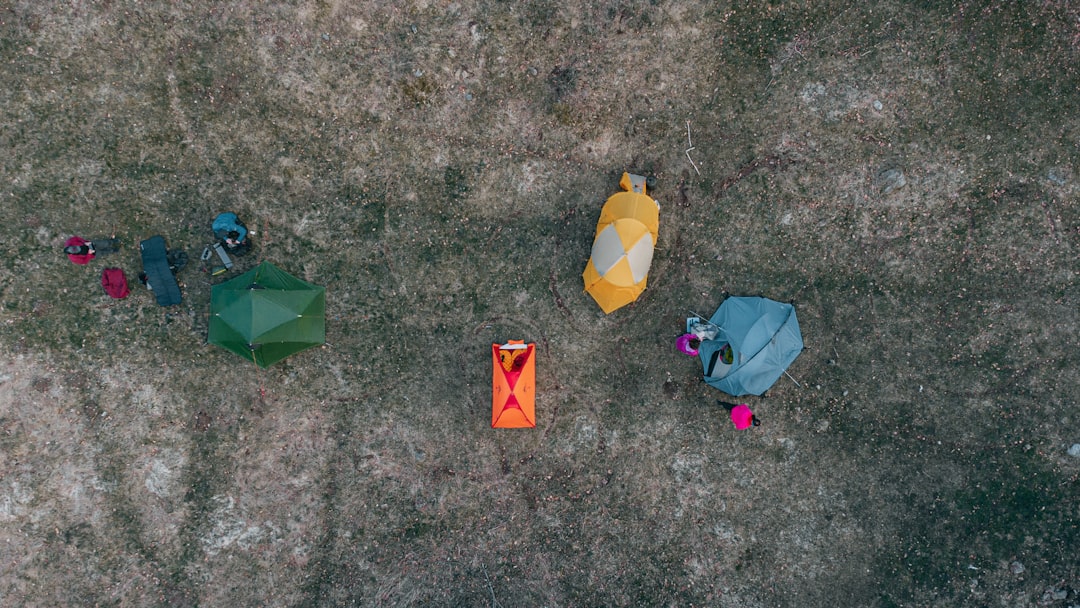 yellow and red plastic bag on ground