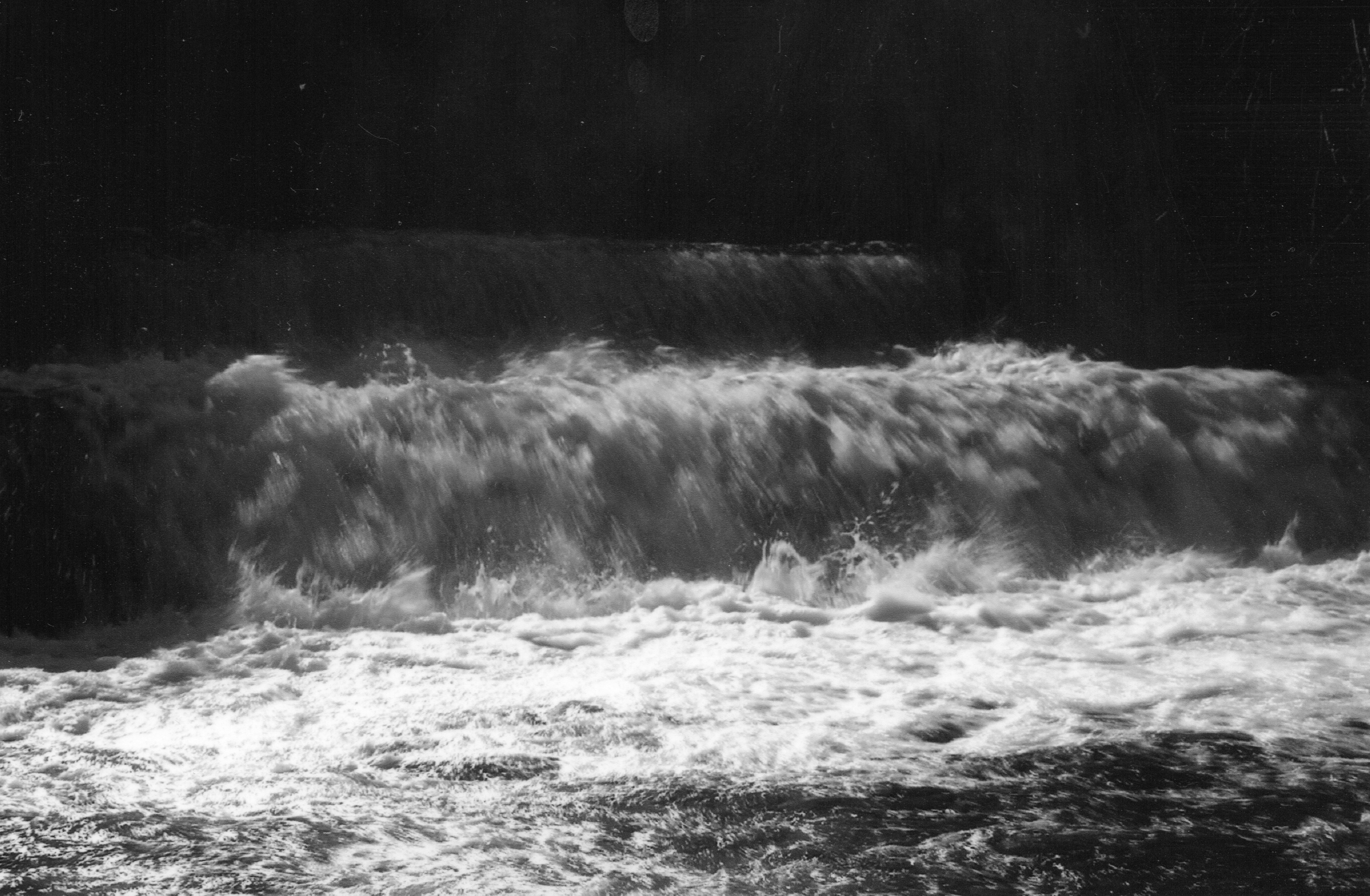 water waves in grayscale photography