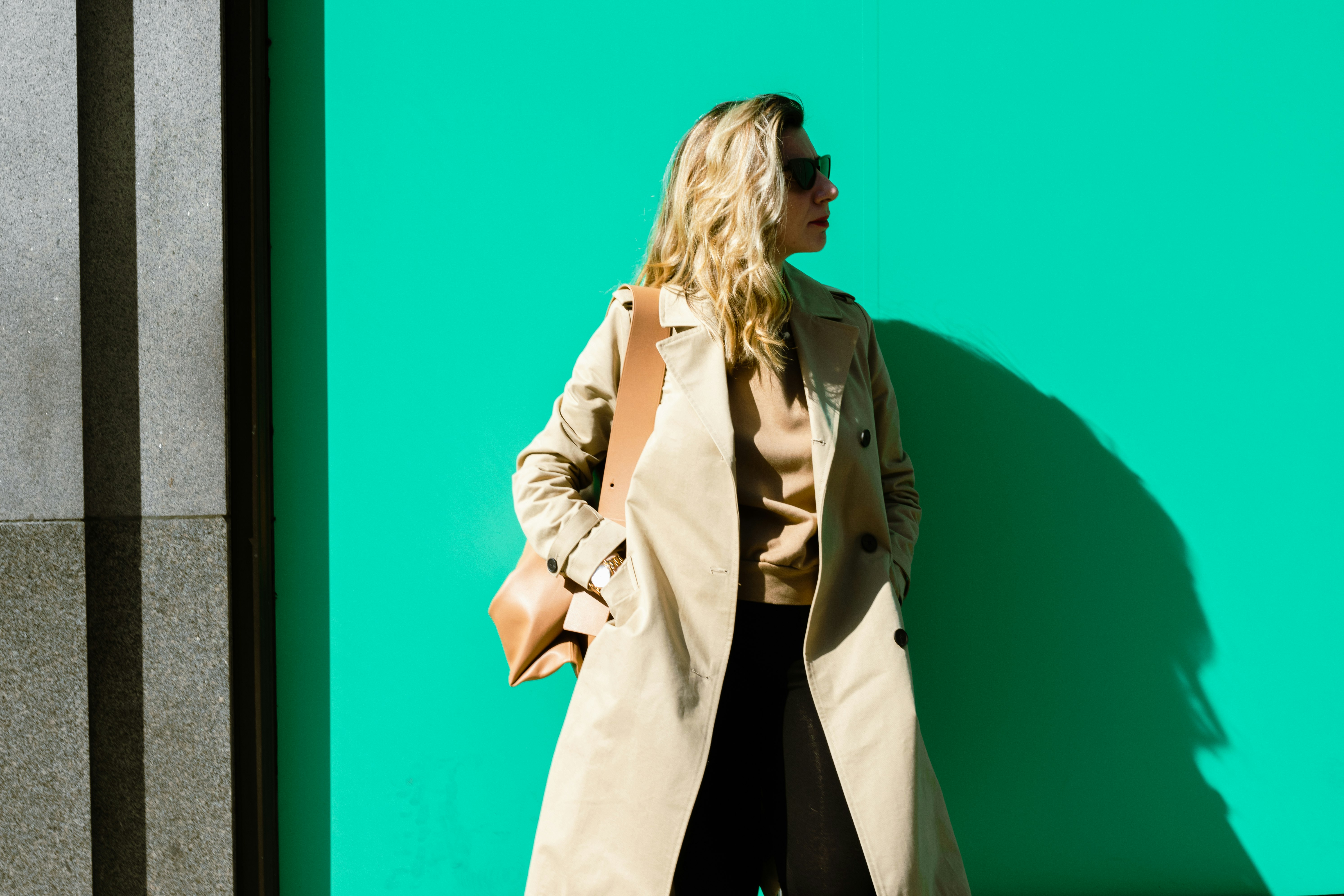 woman in beige coat standing