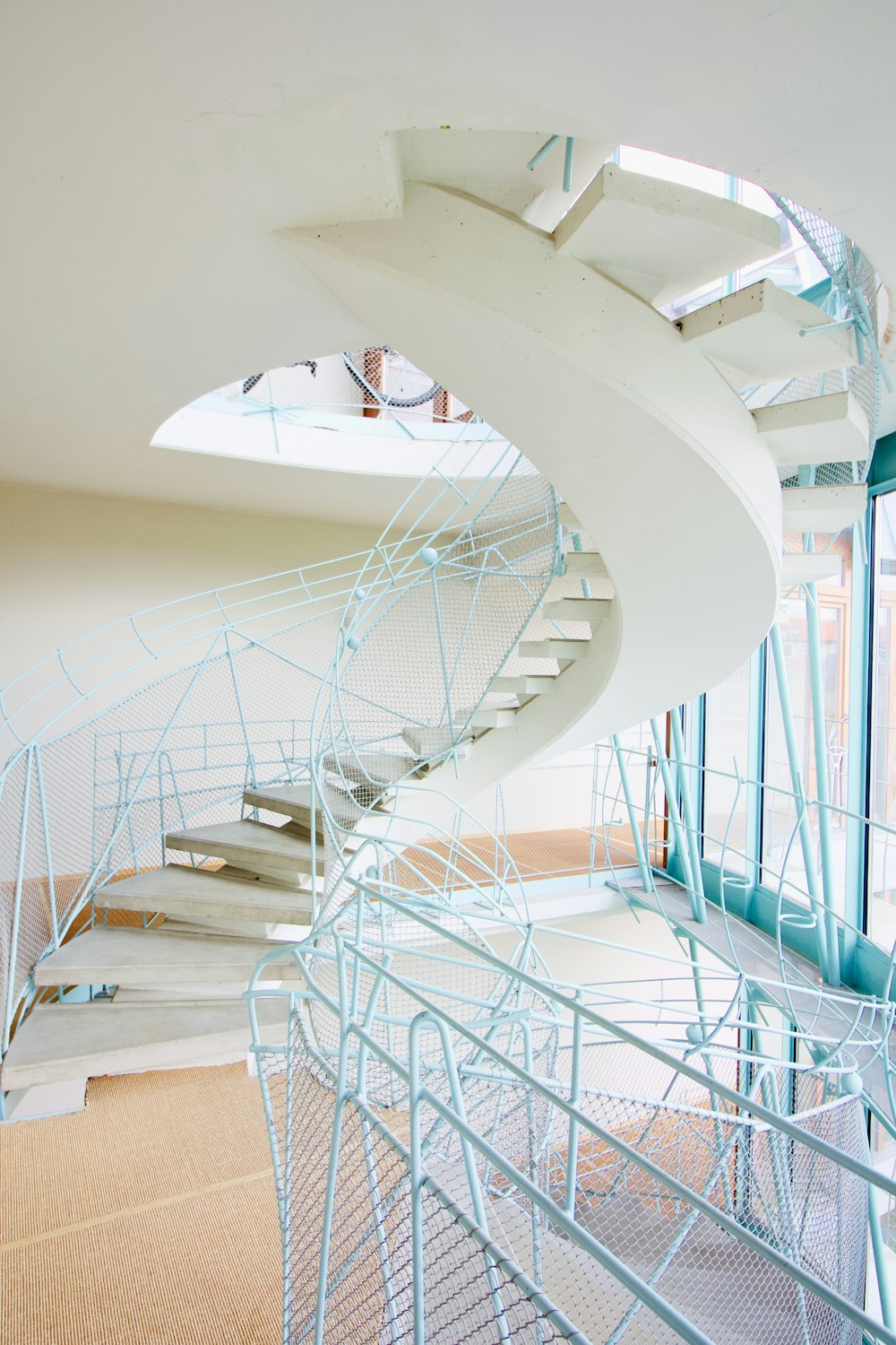 white spiral staircase with white railings