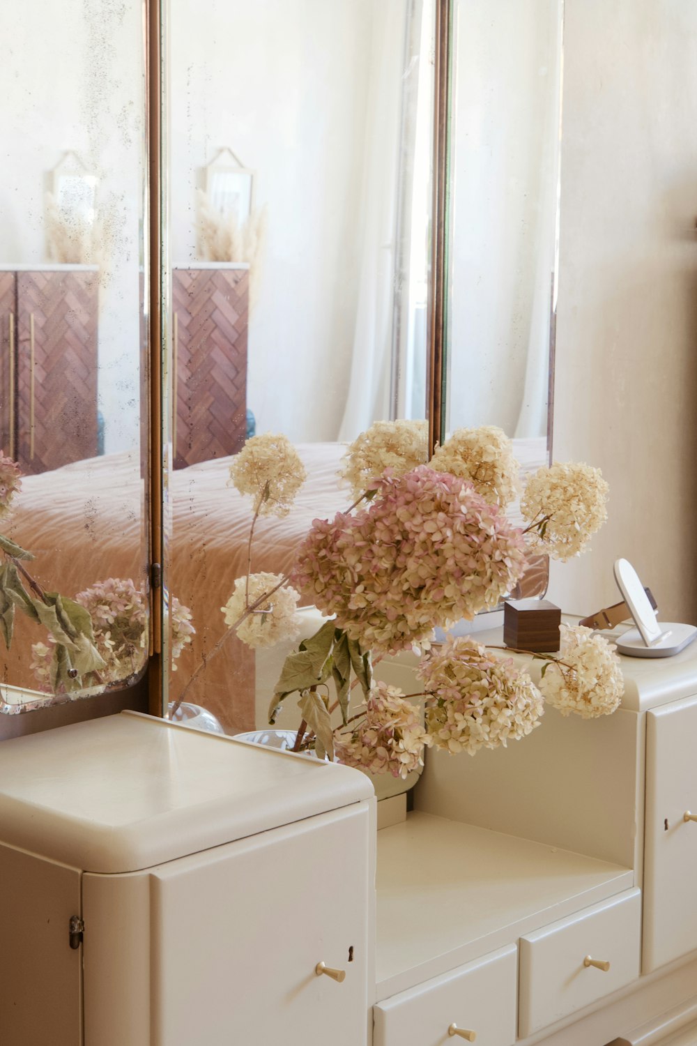 white and pink flowers on white table