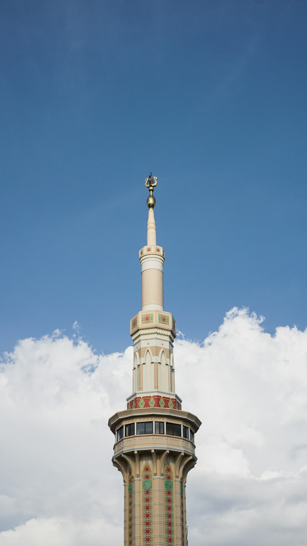 white and brown concrete tower under blue sky during daytime