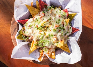 Cheese loaded nachos with Berry Mojito.