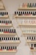 white and black bottles on brown wooden shelf