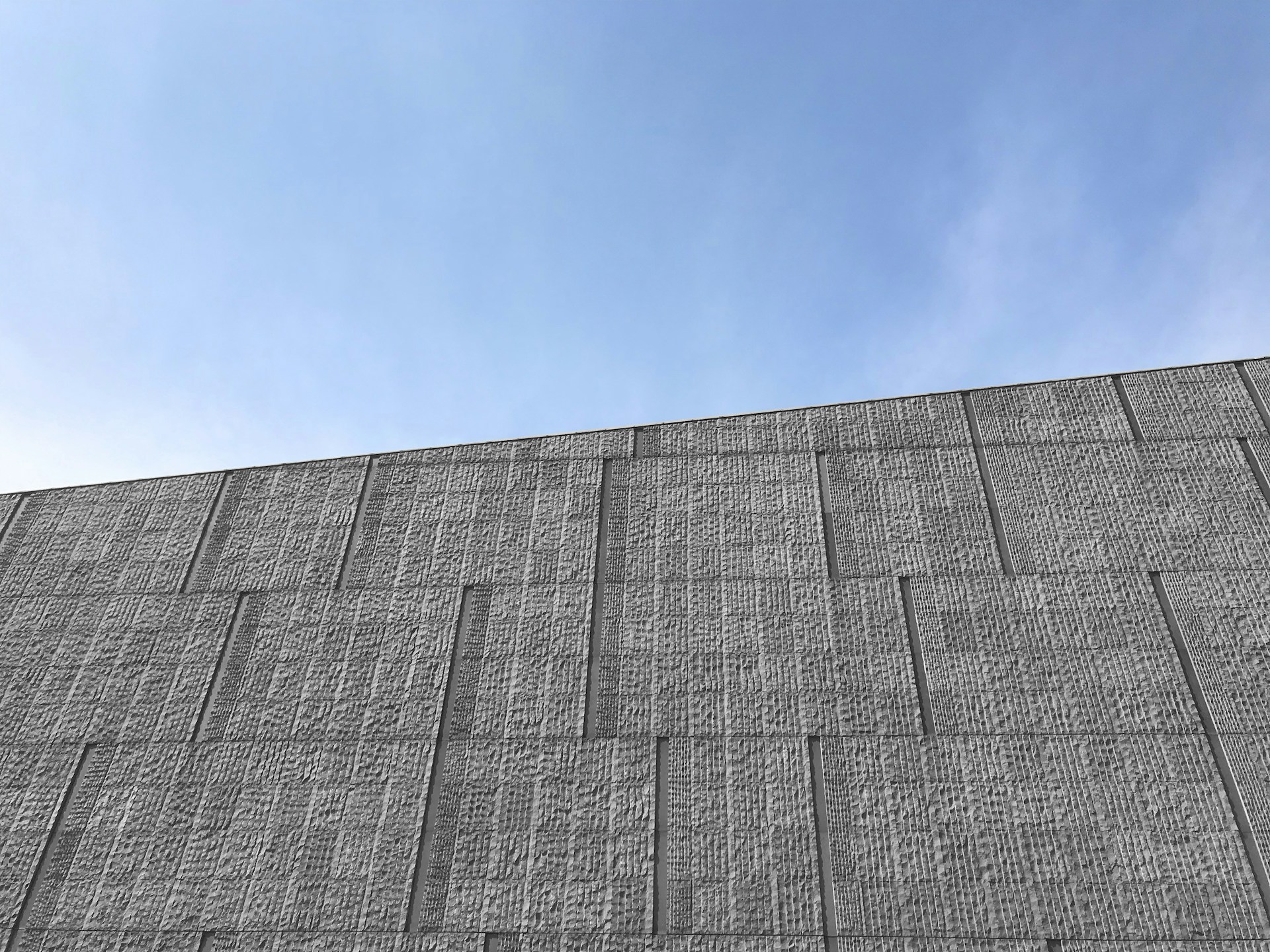 A close-up of precast concrete wall panels being installed at a factory site, demonstrating the quality and efficiency of ss projects' precast factory services.