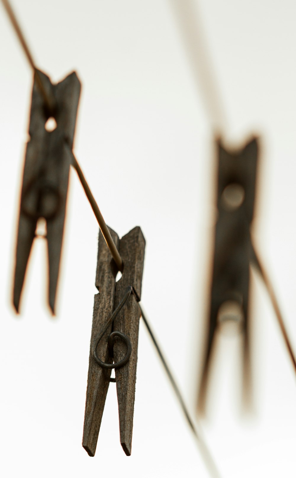 black clothes pin on white surface