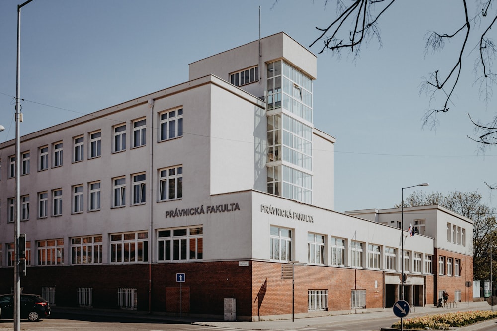 white and brown concrete building under blue sky during daytime