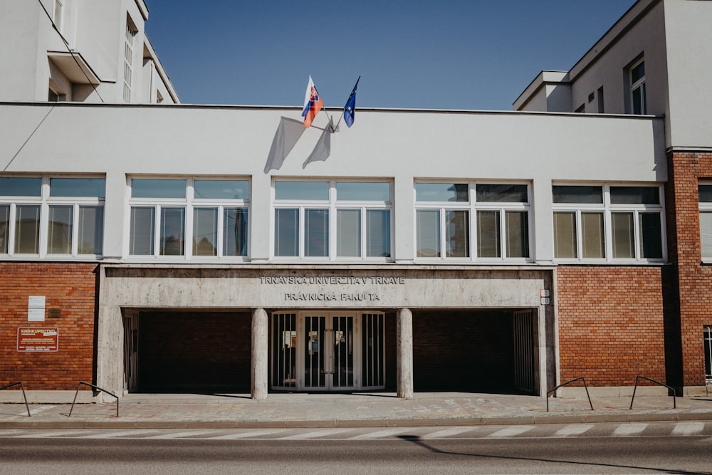 white and brown concrete building under blue sky during daytime