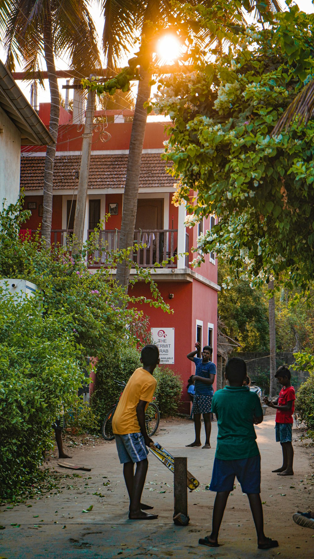 people walking on street near red concrete building during daytime