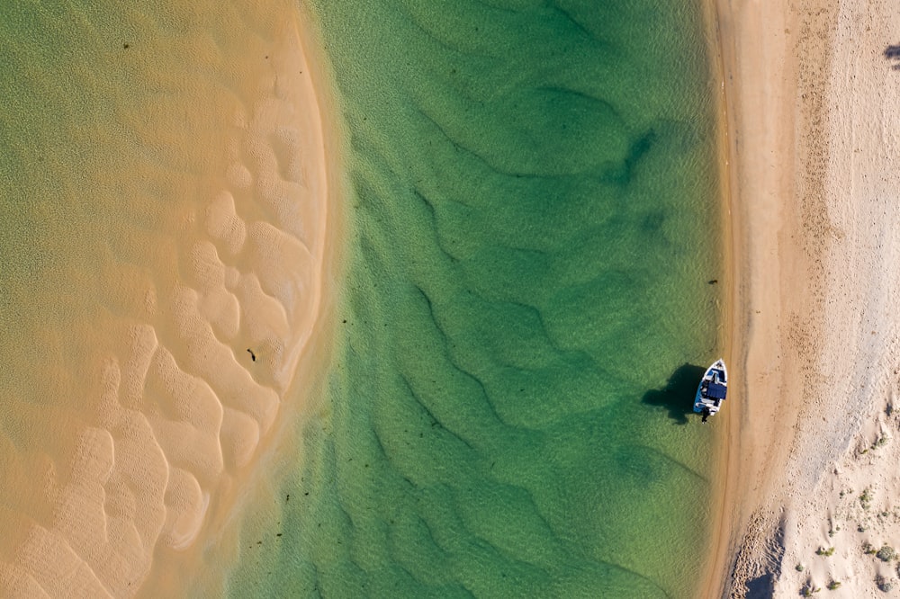 aerial view of boat on sea during daytime