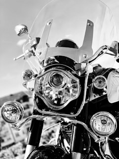 grayscale photo of motorcycle with helmet