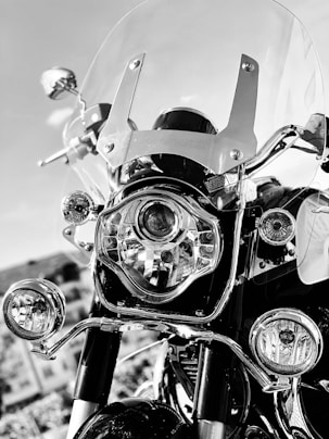 grayscale photo of motorcycle with helmet