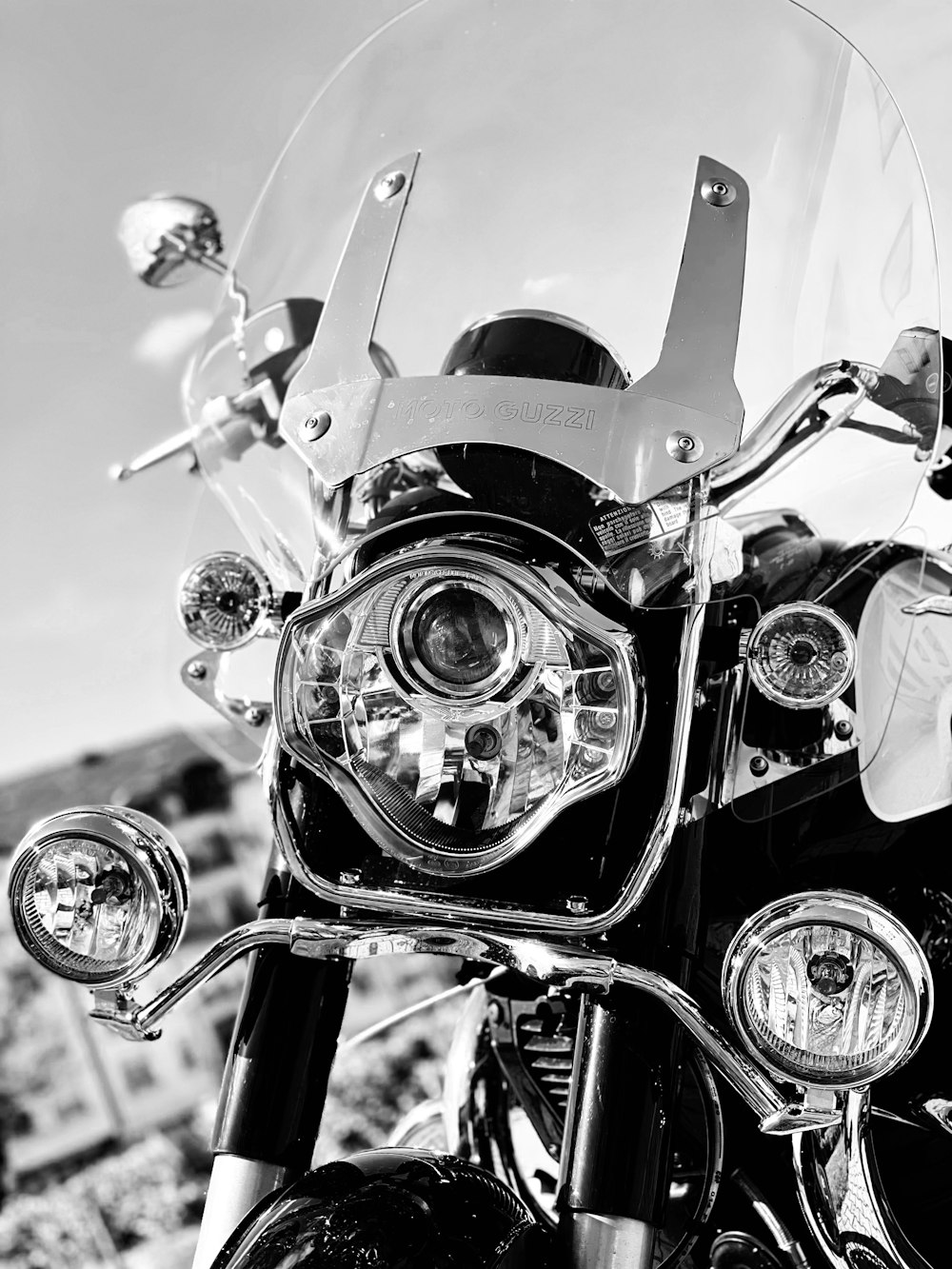 grayscale photo of motorcycle with helmet