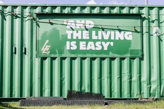 green and white graffiti on wall