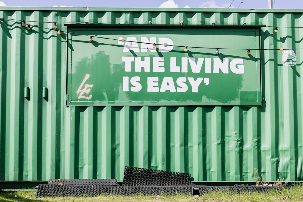 green and white graffiti on wall