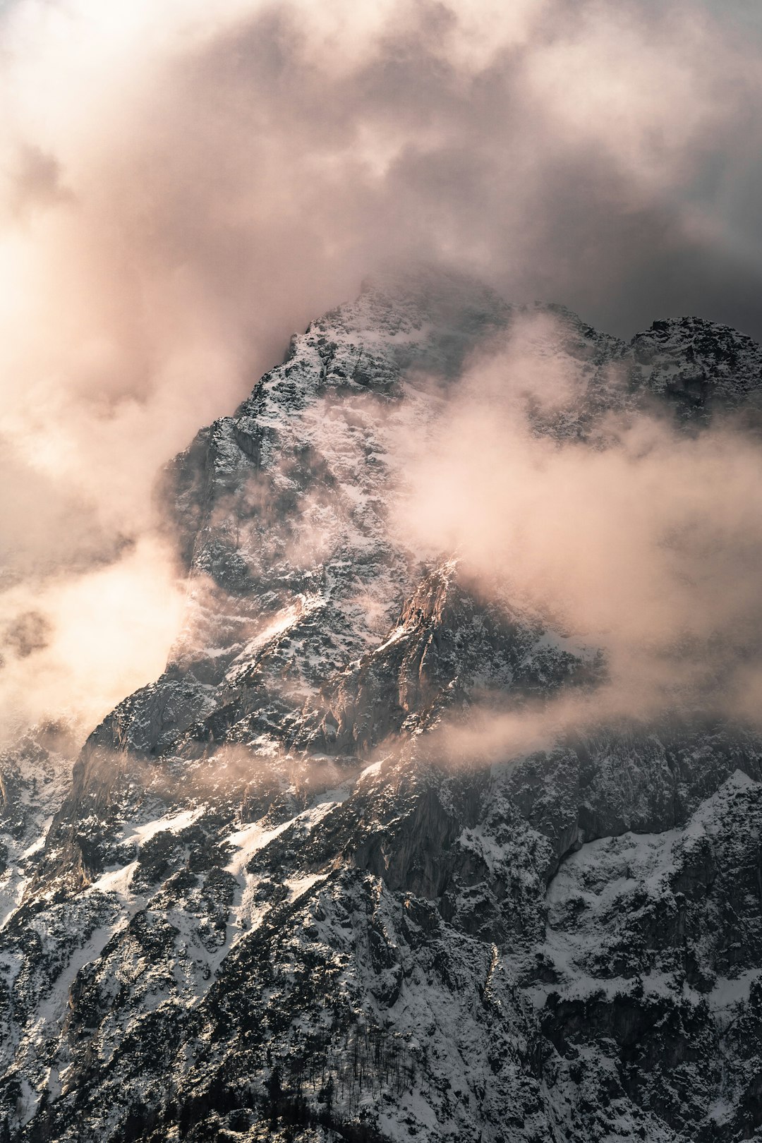 black and white mountain under white clouds