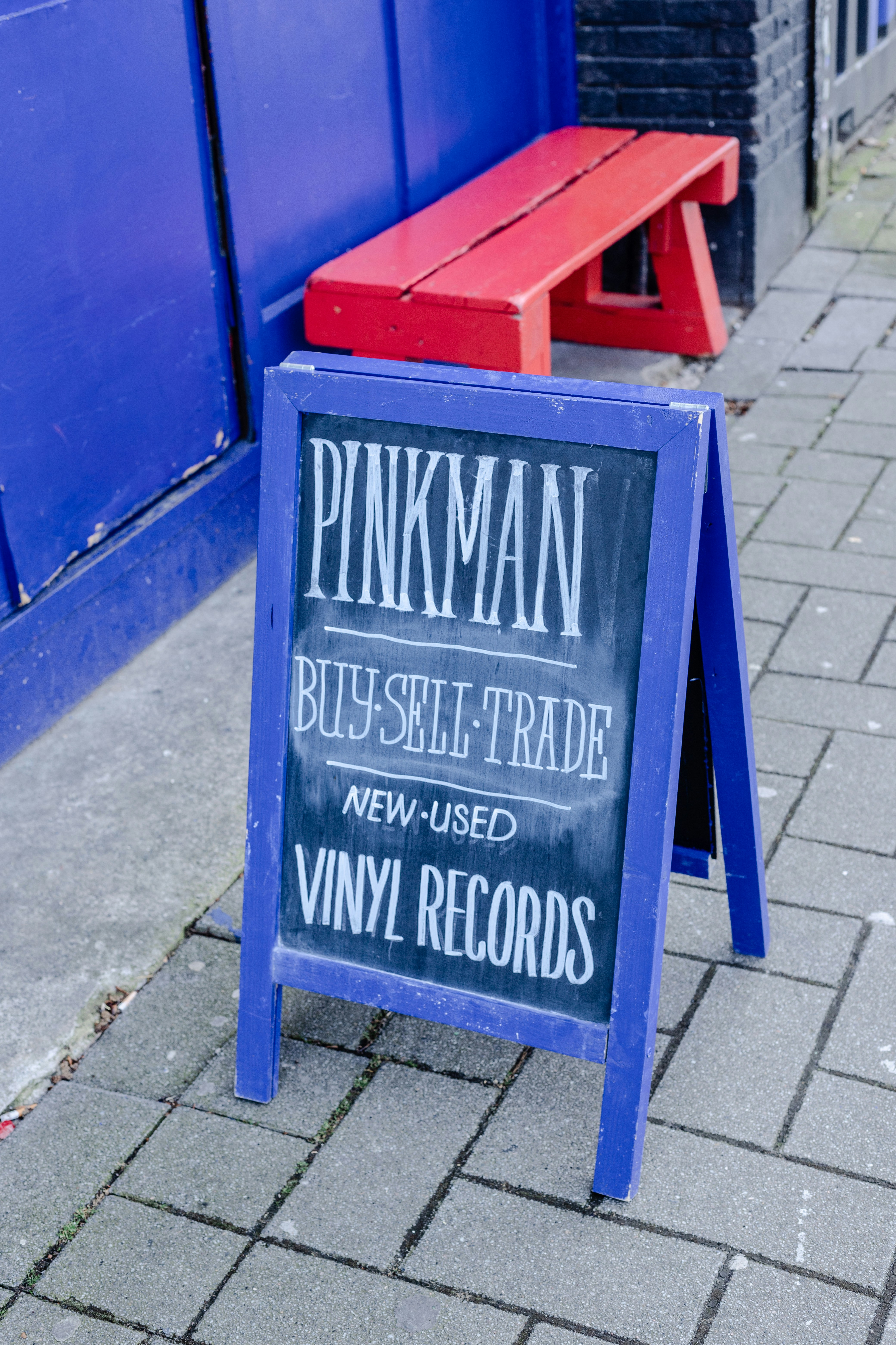 blue and red wooden signage