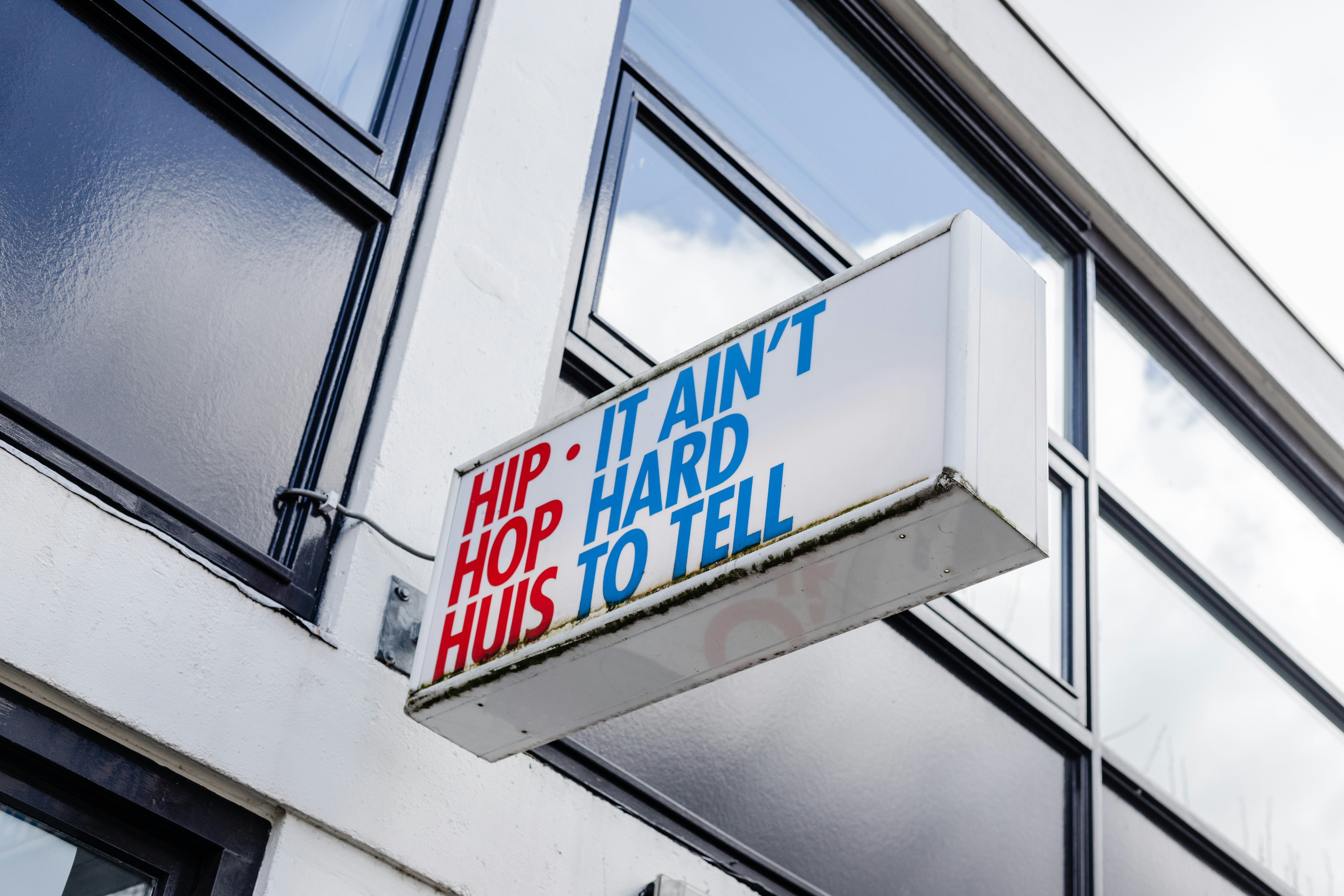 Building sign that says 'hip it isn't hard'