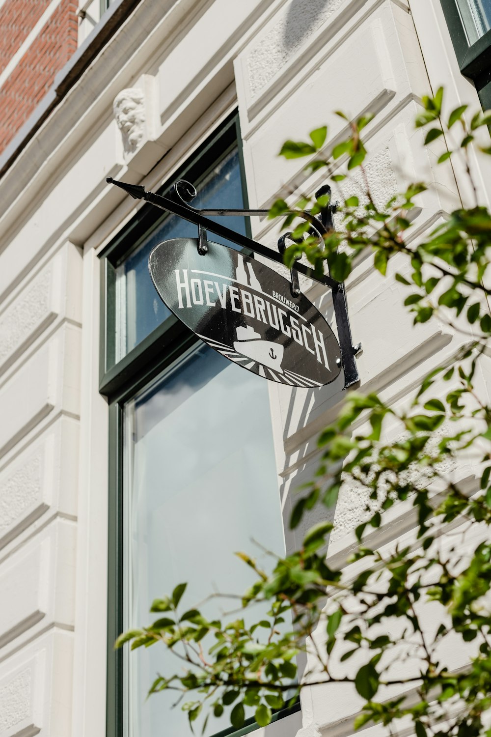 a street sign hanging from the side of a building