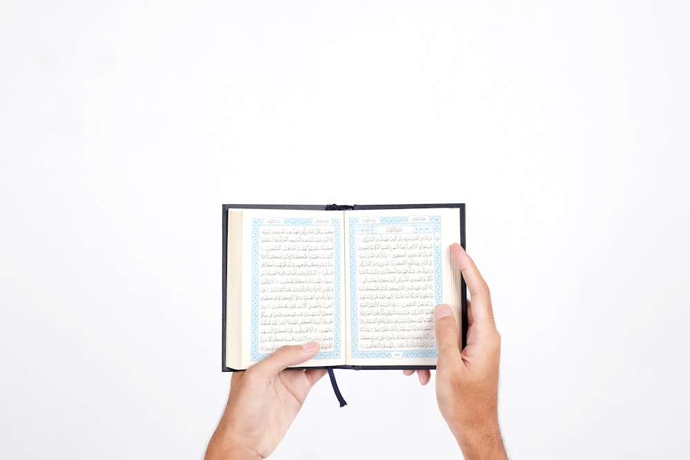 person holding white printer paper