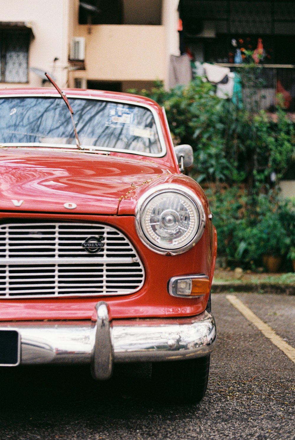 red mercedes benz car on road during daytime