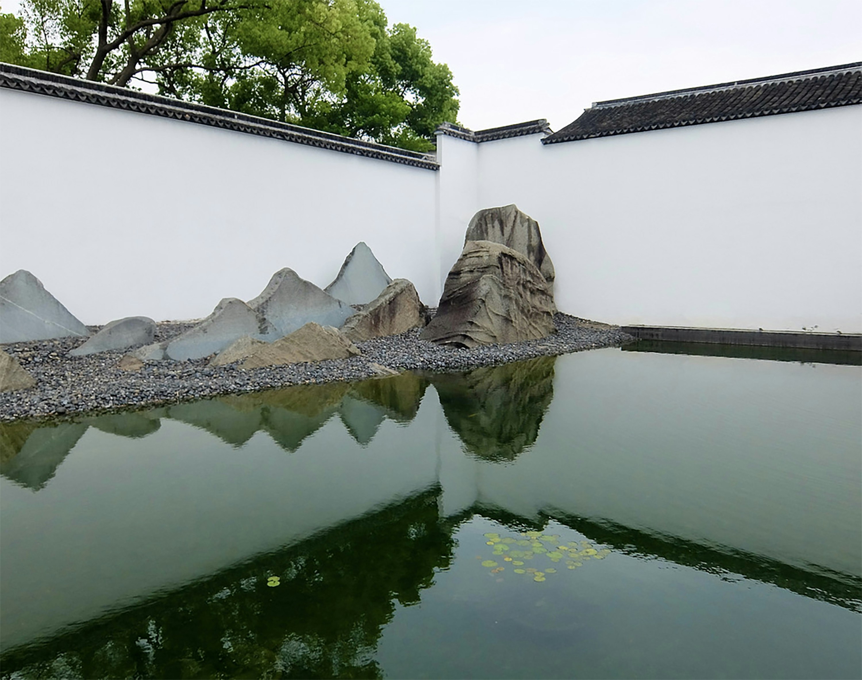 body of water near white concrete building during daytime