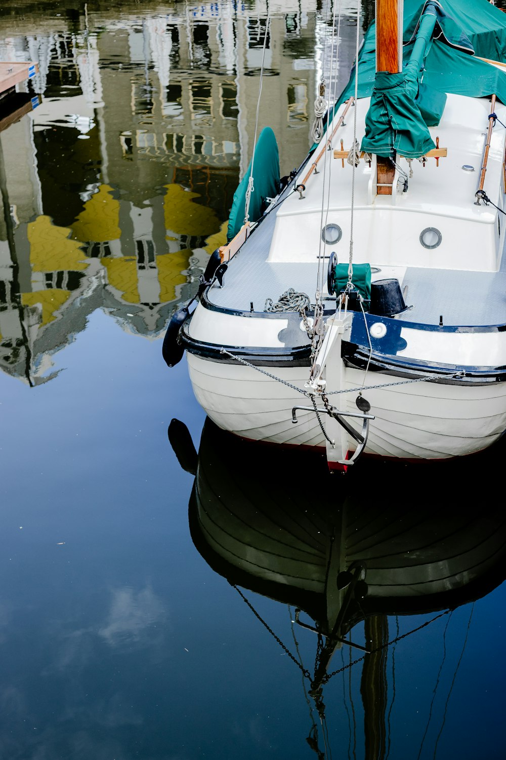 white and black boat on water