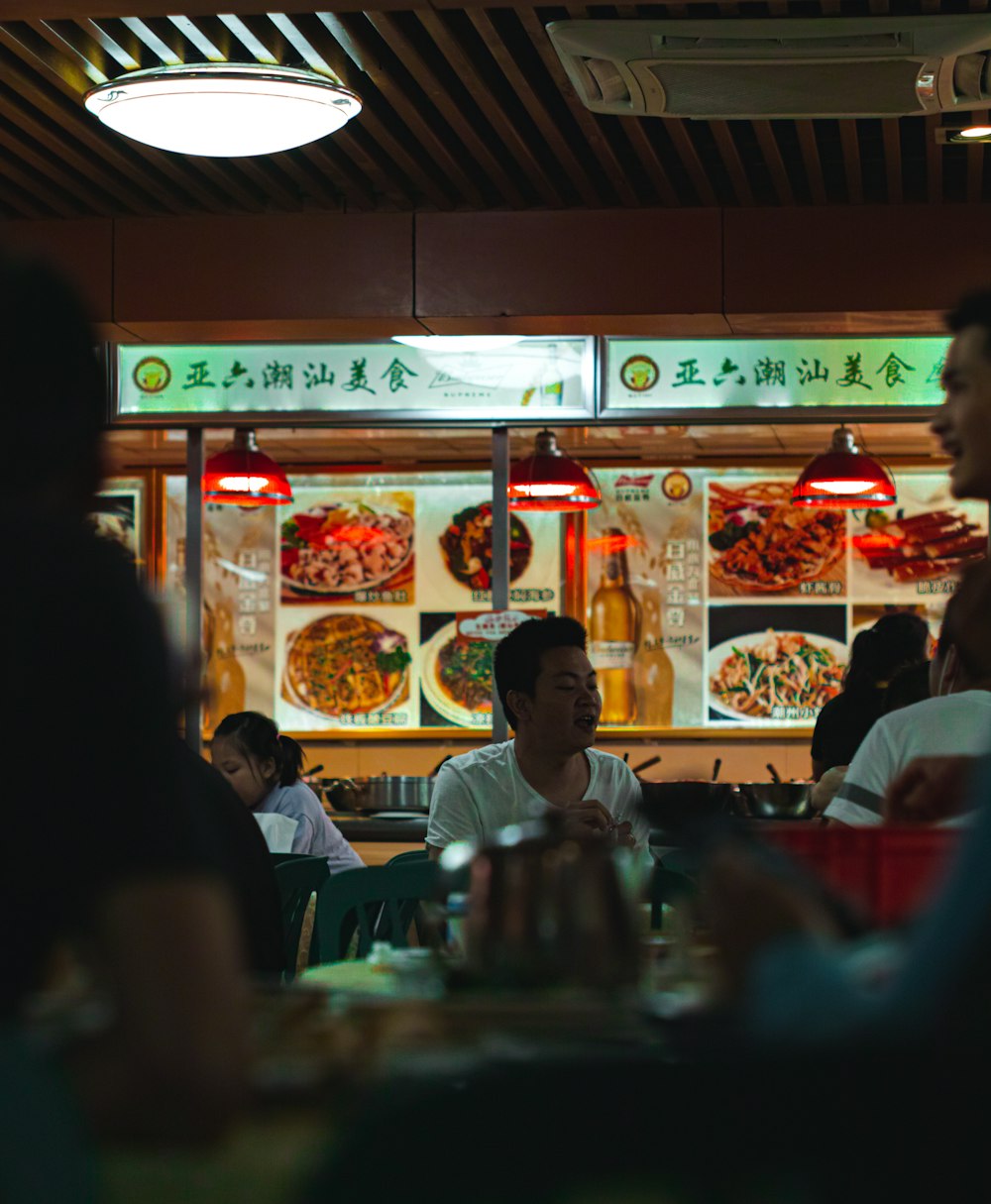 people sitting on chair in restaurant