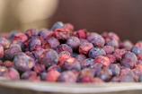 Bright photo showing the vibrant red and purple hues of berry powders ready to be mixed.