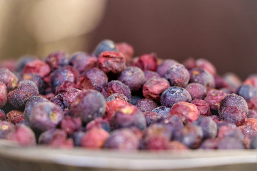 Bright photo showing the vibrant red and purple hues of berry powders ready to be mixed.