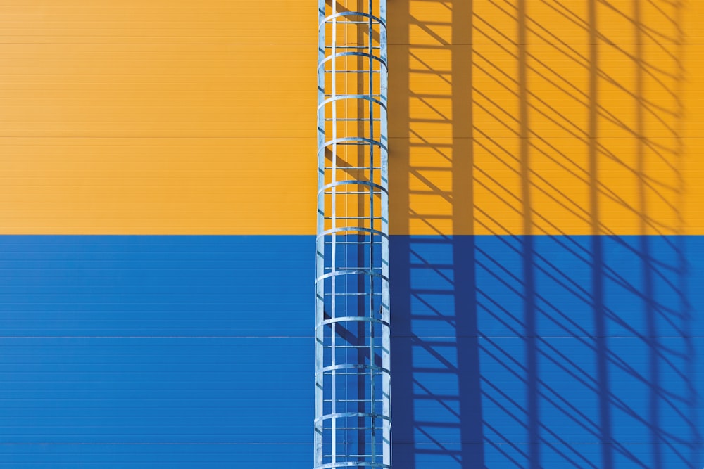 yellow and white metal tower