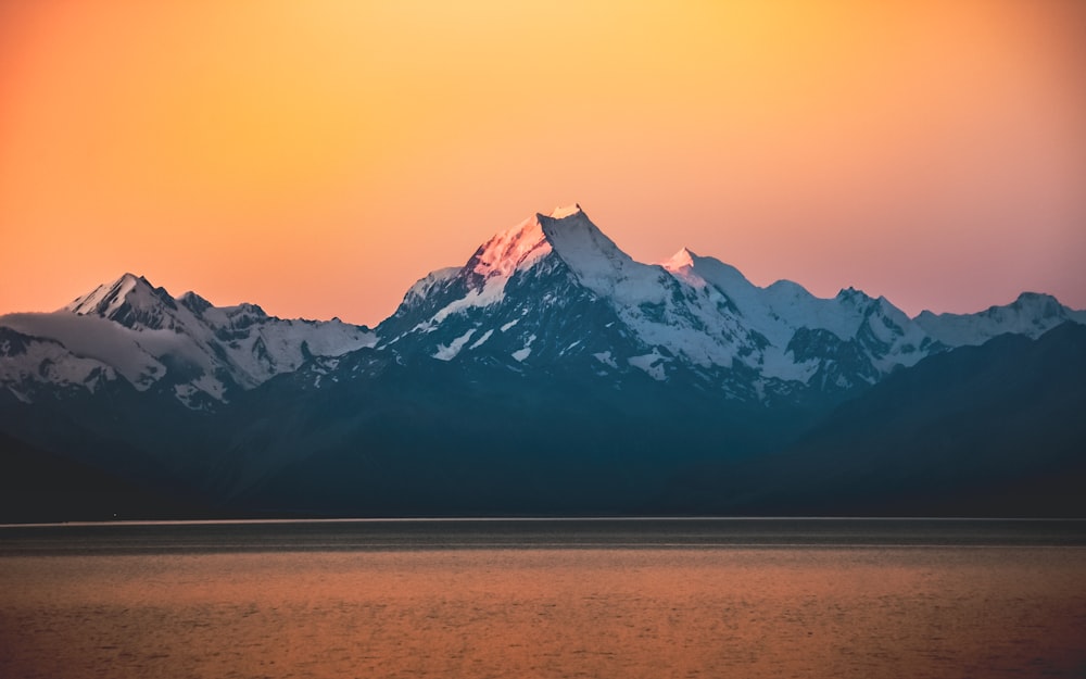 snow covered mountain during daytime