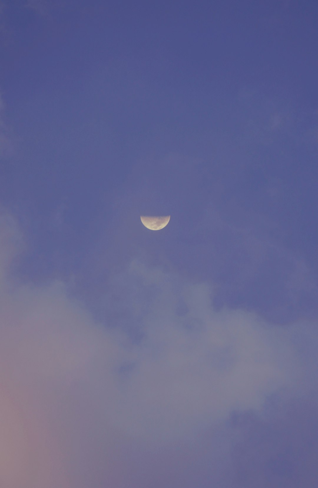 half moon in blue sky