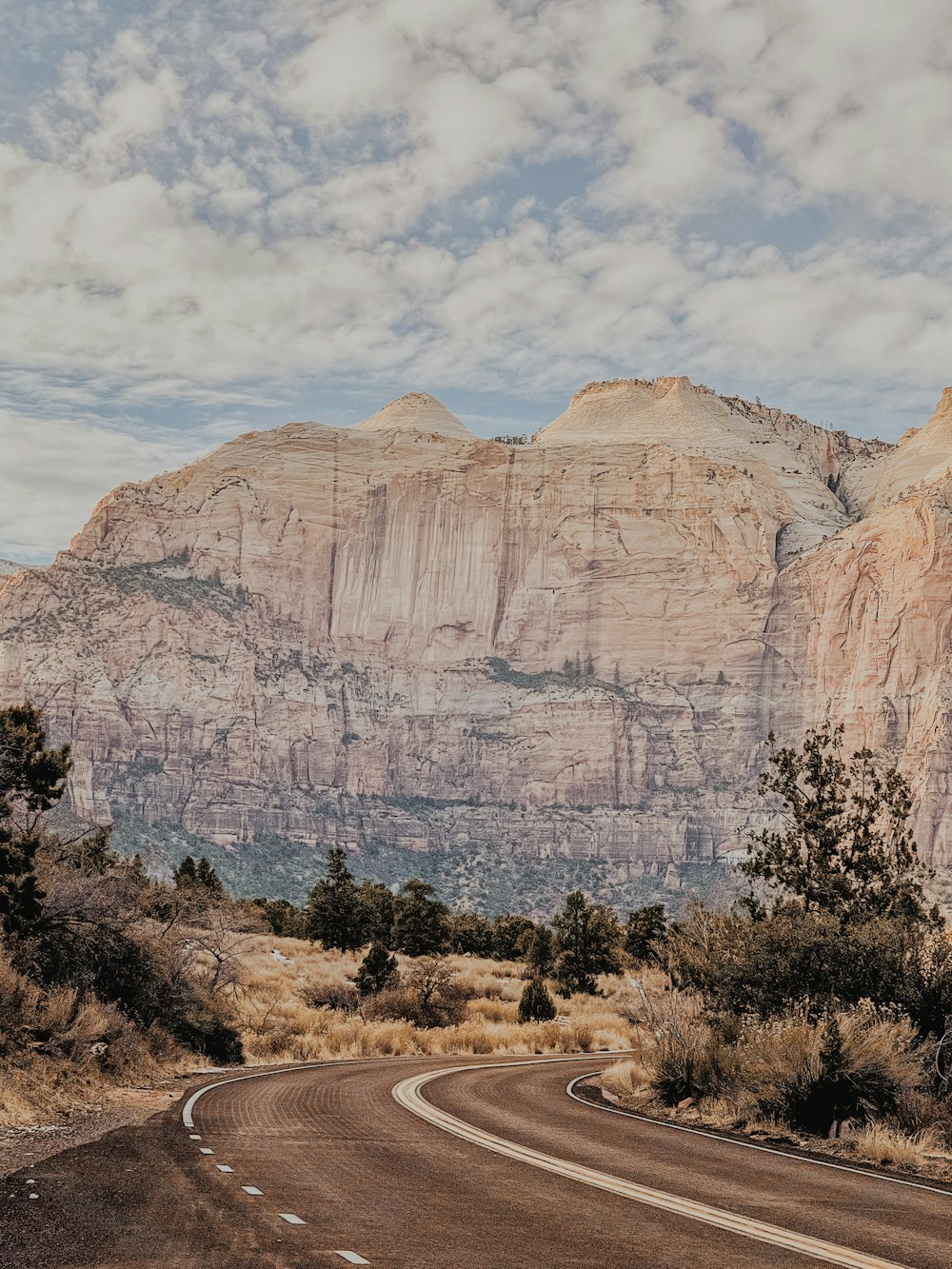 brown rocky mountain under blue sky during daytime