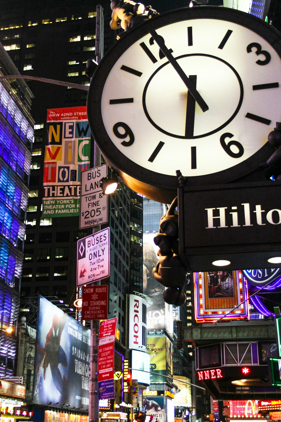 black and white analog clock at 11 00