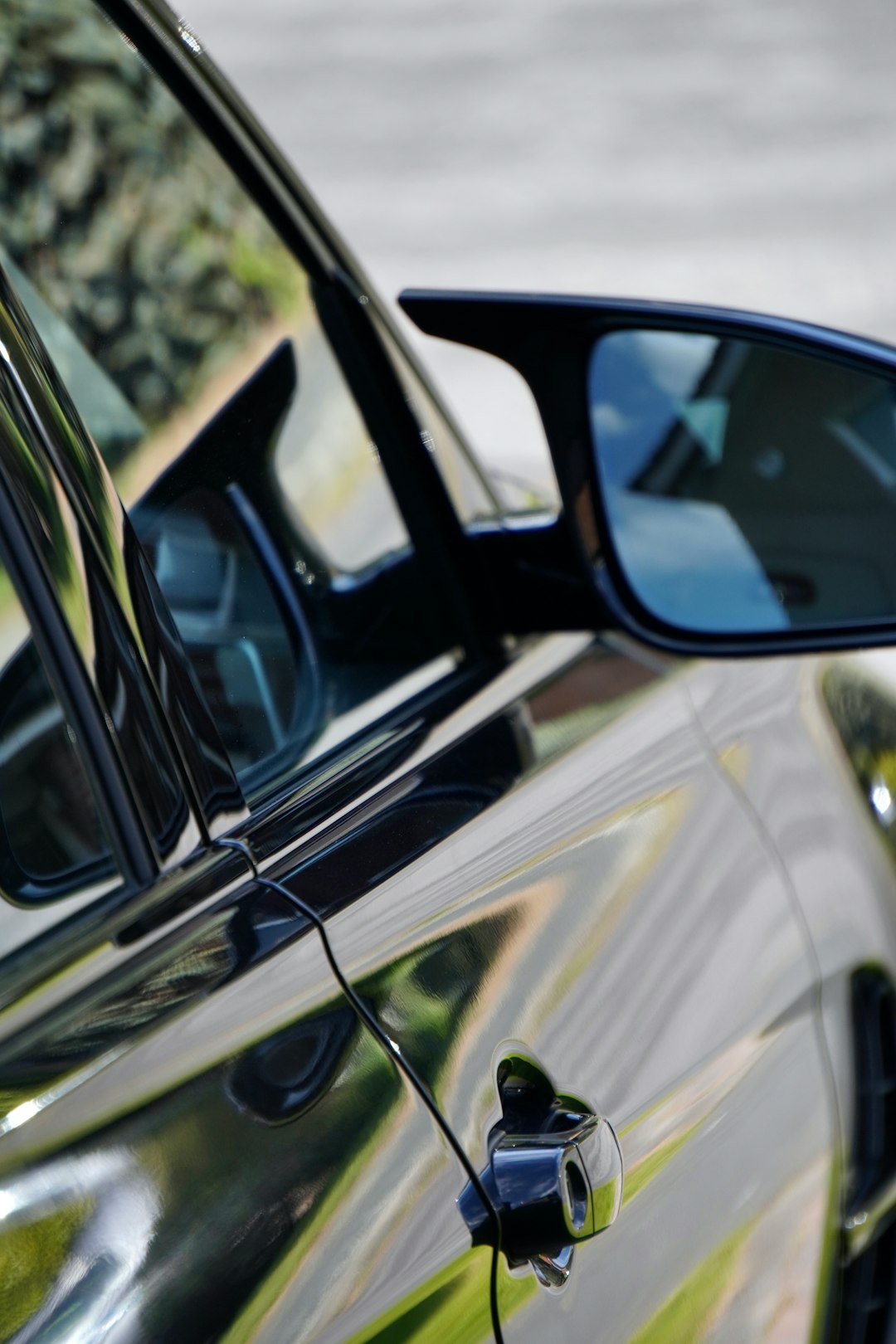 black car side mirror during daytime