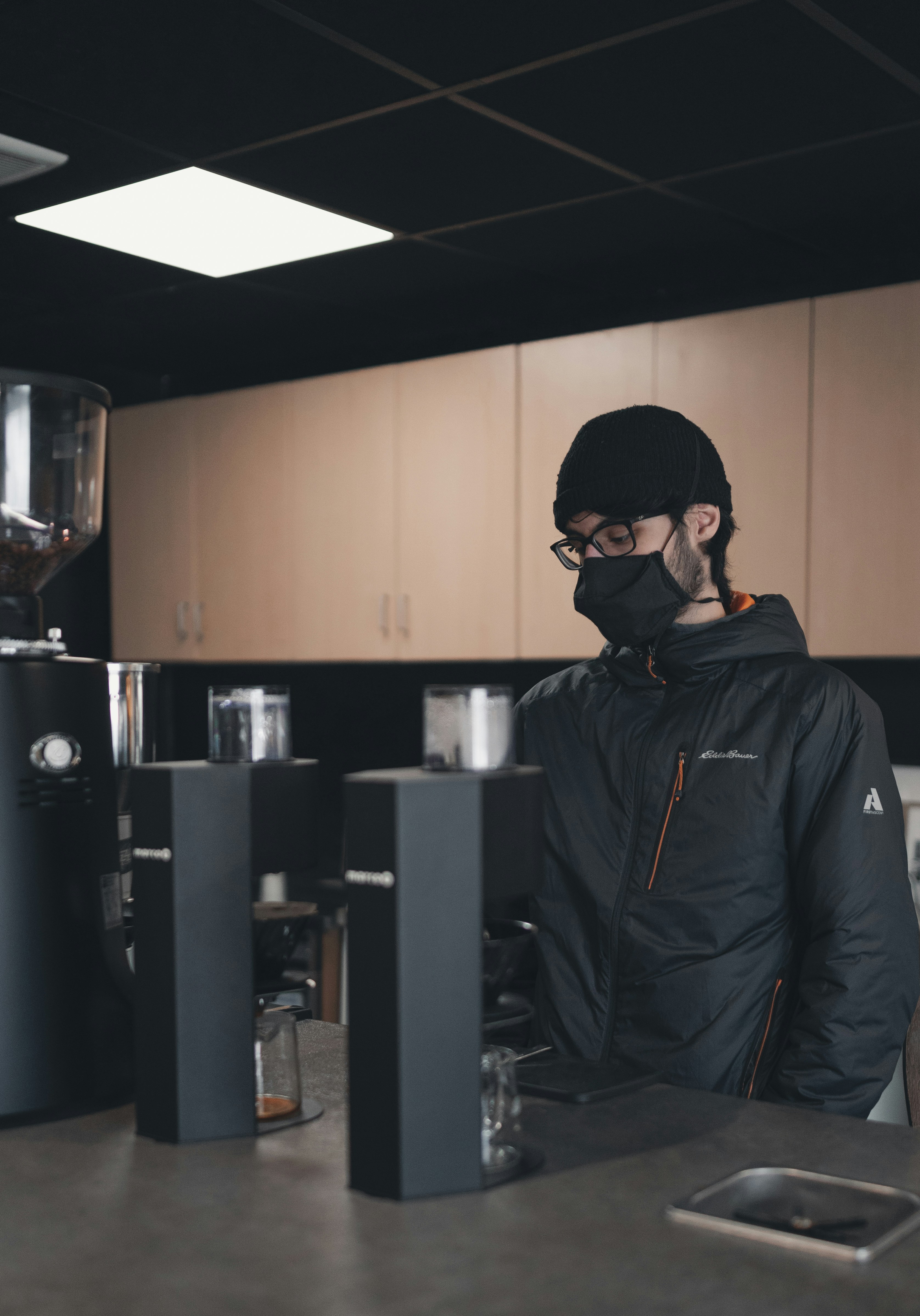 man in black jacket wearing black sunglasses